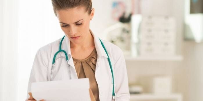 Doctor examines tests to diagnose papillomavirus